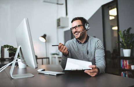Man at desk meant to represent an average CI salesperson.