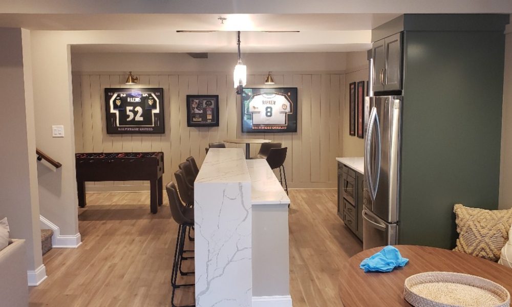Gramophone Revitalizes Basement as a Sports-Themed Entertainment Room, slide 5