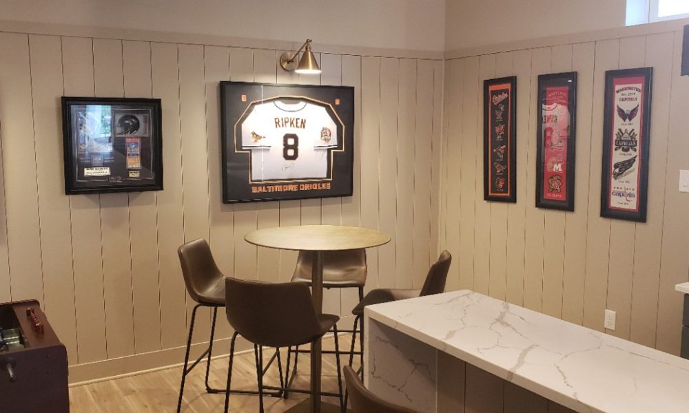 Gramophone Revitalizes Basement as a Sports-Themed Entertainment Room, slide 2