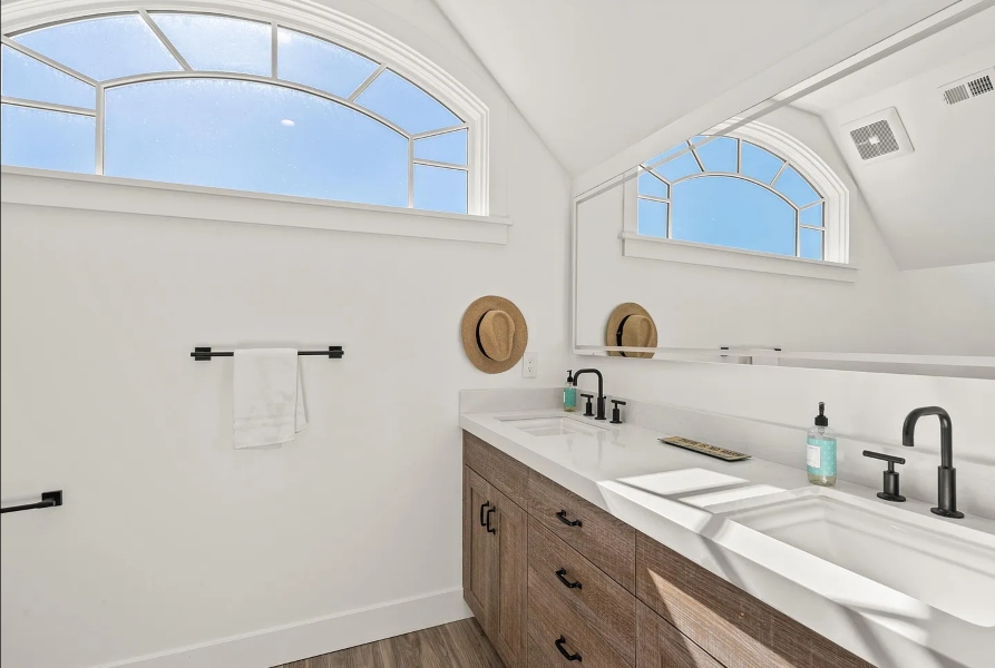 Smart tinting gable window in sundrenched bathroom Pacific Beach home Audio Impact